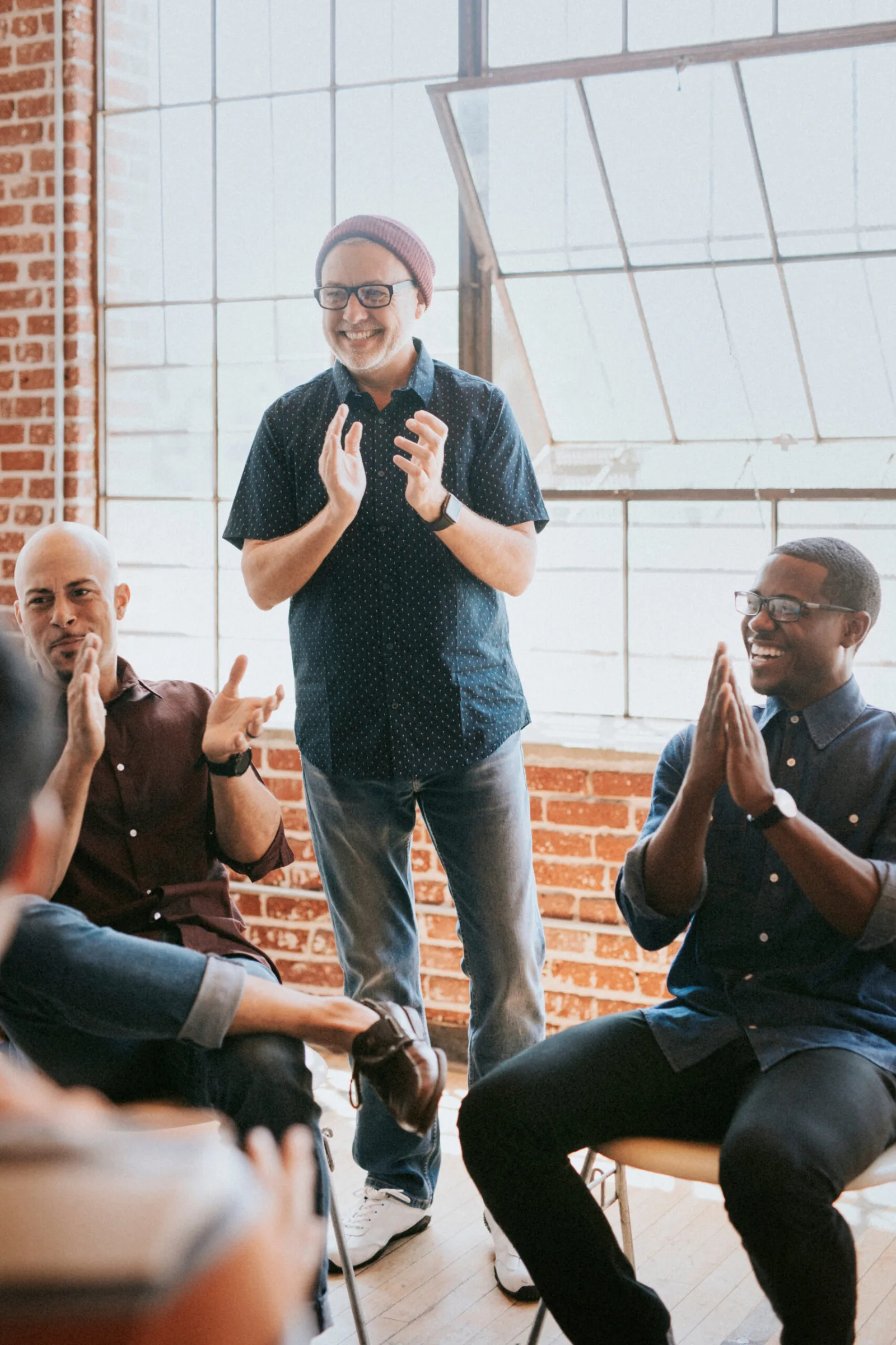 Clients and a therapist in an intensive outpatient group session